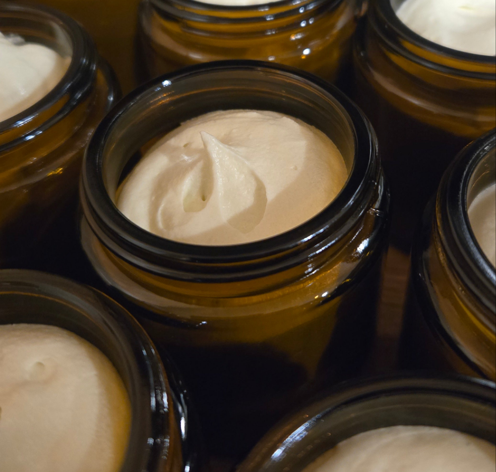 Glass Amber jar, of renewal Elixir whipped tallow butter showing the thick peaks of tallow
