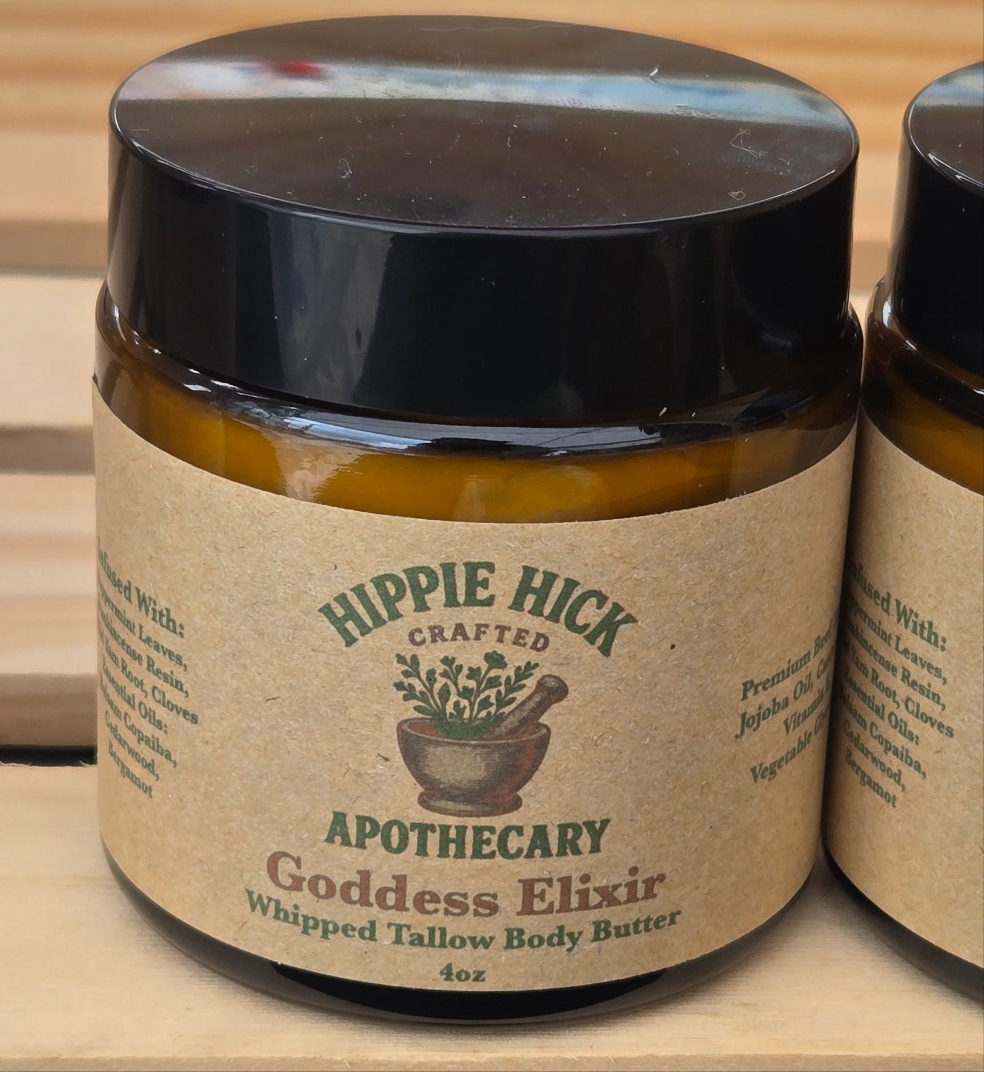 Jar of Hippie Hick Crafted Apothecary Goddess Elixir Whipped Tallow Body Butter on a wooden surface