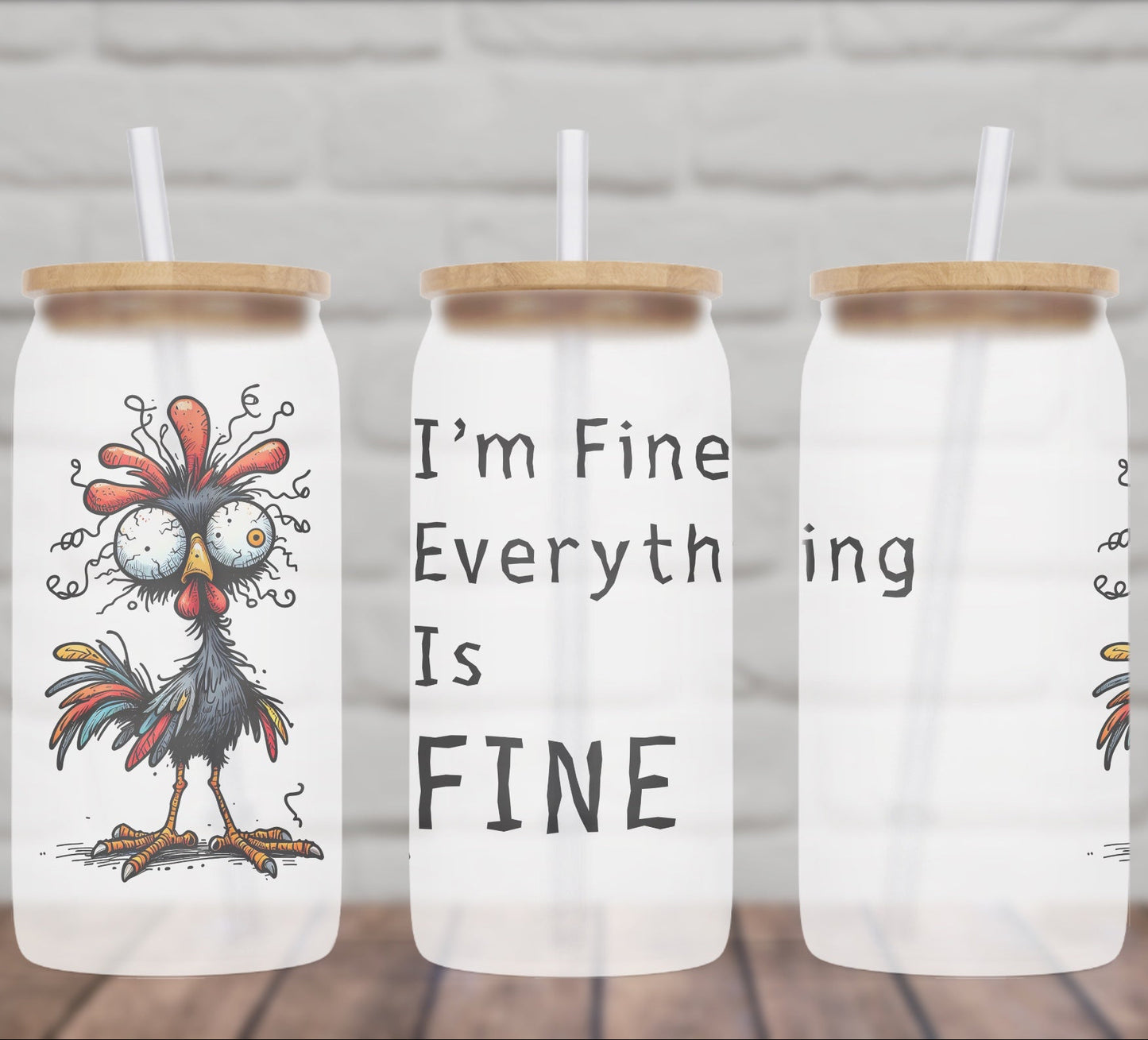 Three glass jars with rooster designs and text on a wooden surface.