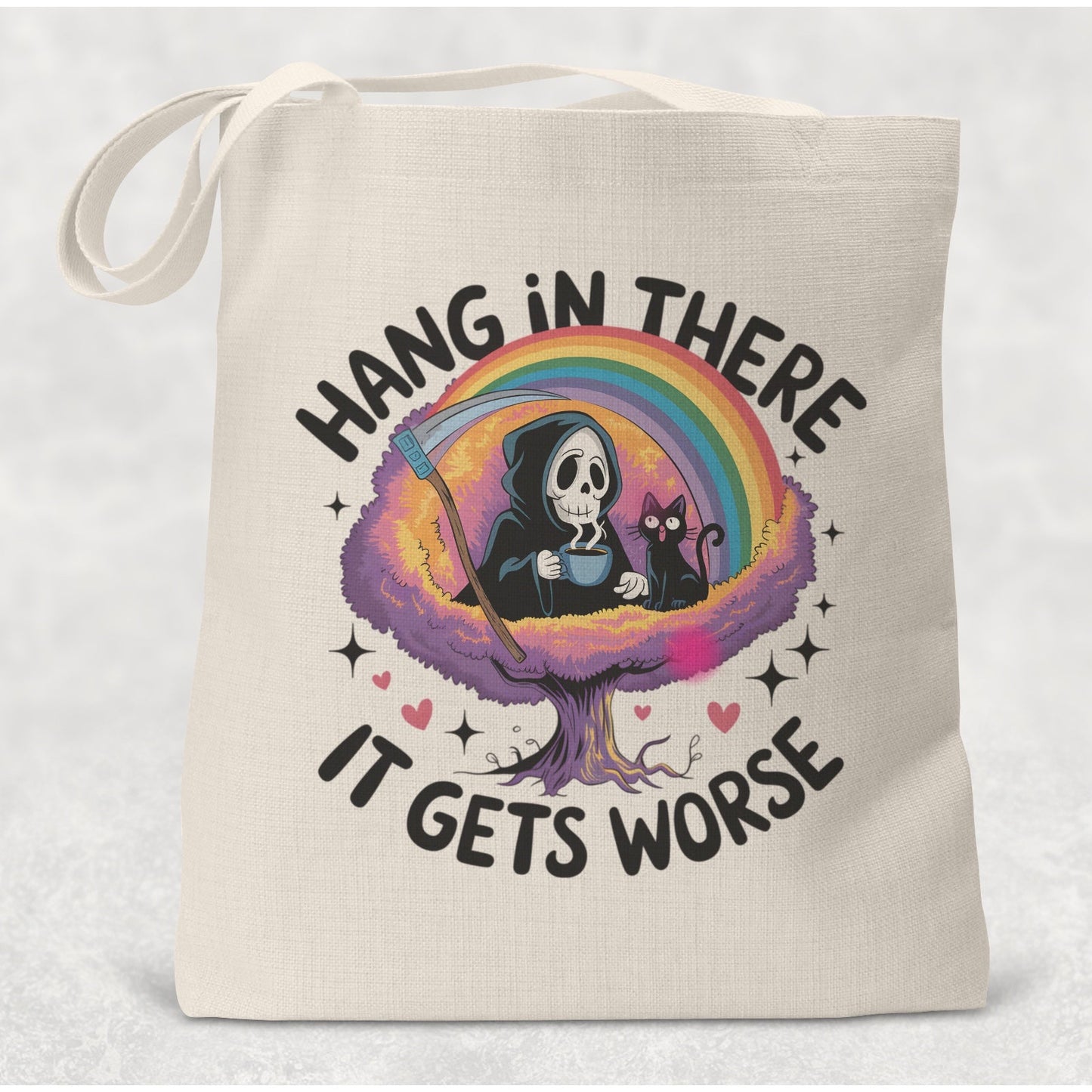 Tote bag with a design of a skeleton, rainbow, and text 'Hang in there it gets worse' on a light background.