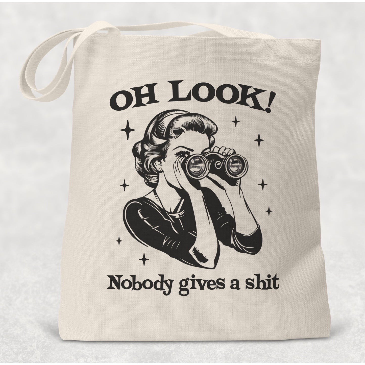 Tote bag with graphic design and text on a light background